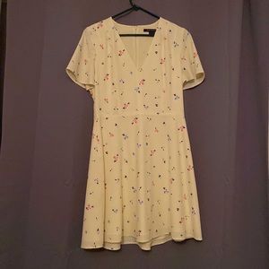 Yellow dress with vague flowers on it